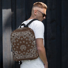 Load image into Gallery viewer, Melodia Gallery brown bandana print polyester backpack with laptop compartment and multiple pockets.