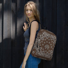 Load image into Gallery viewer, Melodia Gallery brown and white bandana print polyester backpack with laptop compartment and multiple pockets.