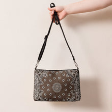 Load image into Gallery viewer, Melodia Gallery chocolate brown crossbody bag with white paisley bandana print and faux leather exterior.