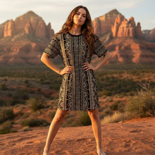 Load image into Gallery viewer, Melodia Gallery black and gold lace-inspired cotton t-shirt dress with short sleeves and ethnic pattern.