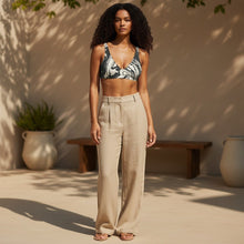 Load image into Gallery viewer, Melodia Gallery black and white marble wash recycled string bikini top with high-waisted linen pants.