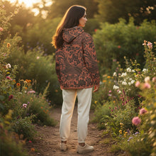 Load image into Gallery viewer, Melodia Gallery unisex cotton hoodie with all-over floral and phoenix print in rust and black. Relaxed fit with drop shoulders.