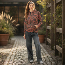 Load image into Gallery viewer, Melodia Gallery unisex cotton hoodie in rust with a black floral and phoenix print, featuring a front pocket and drawstring hood.