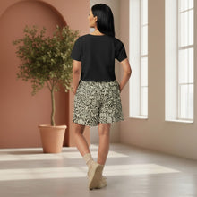Load image into Gallery viewer, Melodia Gallery Flower + Vine Unisex Cotton Long Shorts in beige and dark green floral print. Relaxed fit, 95% cotton.