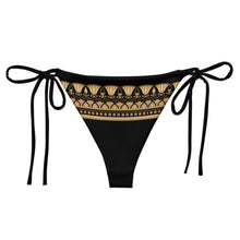 Load image into Gallery viewer, Melodia Gallery black bikini bottom with gold lotus and geometric trim, adjustable side ties, recycled polyester.