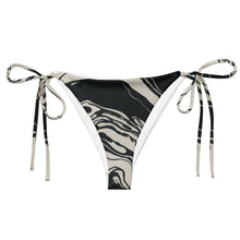 Load image into Gallery viewer, Melodia Gallery black and white marble print recycled string bikini bottom with adjustable tie sides and UPF 50+ protection.