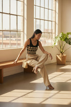 Load image into Gallery viewer, Melodia Gallery black cotton crop top with Nile Bloom pattern, gold and cream geometric design, scoop neck.