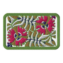 Load image into Gallery viewer, Melodia Gallery embroidered passionflower tactical patch with hook and loop backing. Features pink flowers, green border, and botanical design.