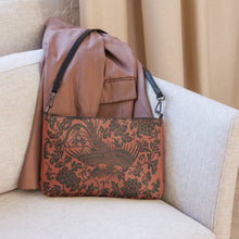 Load image into Gallery viewer, Melodia Gallery faux leather crossbody bag with a vintage Qing Dynasty inspired phoenix and floral pattern in black on a rust background.