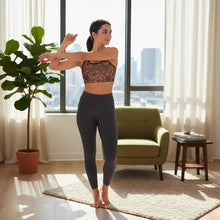 Load image into Gallery viewer, Melodia Gallery Phoenix + Floral sports bra in coral with black trim, scoop neck, racerback, and recycled polyester fabric.