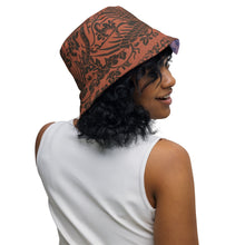 Load image into Gallery viewer, Melodia Gallery reversible bucket hat with phoenix and floral pattern in earth tones and lavender/blue. Soft fabric.