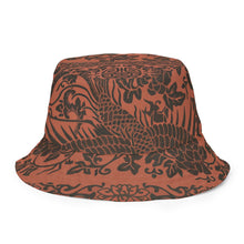 Load image into Gallery viewer, Melodia Gallery reversible bucket hat with phoenix and floral pattern in earth tones. Soft fabric, classic silhouette.