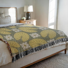 Load image into Gallery viewer, Melodia Gallery vintage woven cotton blanket with a water lily pattern in green and yellow, featuring fringed edges.