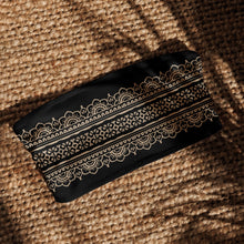 Load image into Gallery viewer, Melodia Gallery black bandeau bikini top with lace flower pattern and UPF 50+ sun protection. Made from recycled polyester.

