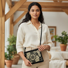 Load image into Gallery viewer, Melodia Gallery Art Nouveau Floral Crossbody Bag in black faux leather with gold floral design. Adjustable straps.
