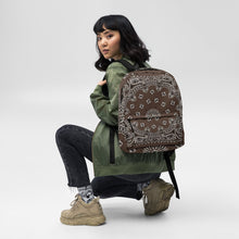 Load image into Gallery viewer, Melodia Gallery brown and white bandana print polyester backpack with laptop compartment and multiple pockets.
