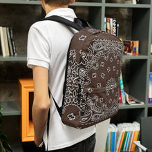 Load image into Gallery viewer, Melodia Gallery brown and white bandana print polyester backpack with padded straps and multiple pockets.
