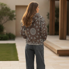 Load image into Gallery viewer, Melodia Gallery brown unisex cotton hoodie with all-over white paisley print, drawstring hood, and front pocket.
