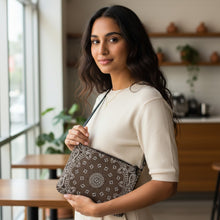 Load image into Gallery viewer, Melodia Gallery brown faux leather crossbody bag with white paisley bandana print. Adjustable strap.
