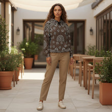 Load image into Gallery viewer, Melodia Gallery unisex cotton bandana print hoodie in brown with white detailing, featuring a front pocket and drawstring hood.
