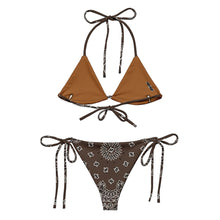Load image into Gallery viewer, Melodia Gallery brown recycled string bikini with bandana print. Features adjustable ties and removable padding.
