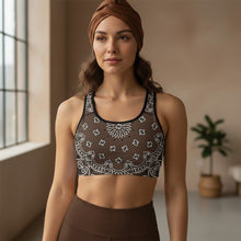 Load image into Gallery viewer, Melodia Gallery brown bandana print sports bra with racerback and black trim. Moisture-wicking fabric.
