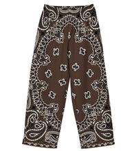 Load image into Gallery viewer, Melodia Gallery unisex brown bandana print wide leg pants made of cotton and elastane with adjustable waist.
