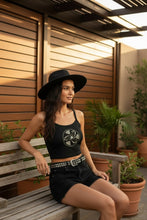 Load image into Gallery viewer, Melodia Gallery black 100% cotton micro-rib tank top with Vintage Fish &amp; Lotus graphic. Model wears black shorts and hat.
