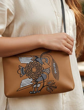 Load image into Gallery viewer, Melodia Gallery cognac faux leather crossbody bag with vintage Ukrainian folk art bird and floral design. Adjustable strap.
