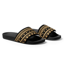 Load image into Gallery viewer, Melodia Gallery Egyptian Lotus women's black slides with gold patterned straps, faux leather, and textured footbed.
