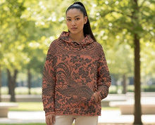 Load image into Gallery viewer, Melodia Gallery unisex cotton hoodie with all-over floral and phoenix print in rust and dark grey. Features a relaxed fit, drop shoulders, and front pocket.
