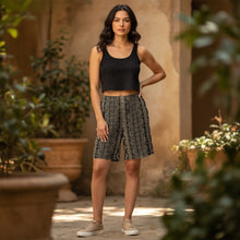 Load image into Gallery viewer, Melodia Gallery black and tan lace print unisex cotton elastane long shorts with relaxed fit.

