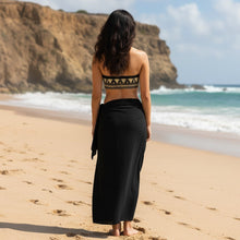 Load image into Gallery viewer, Melodia Gallery black bandeau bikini top with gold lotus pattern, made from recycled polyester and elastane.
