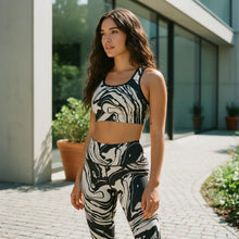 Load image into Gallery viewer, Melodia Gallery black and white marble wash sports bra with scoop neckline and racerback. Moisture-wicking polyester-elastane blend.
