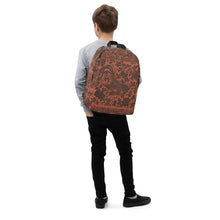Load image into Gallery viewer, Melodia Gallery terracotta backpack with a dark brown phoenix and floral print. Features a laptop pocket and hidden back pocket.
