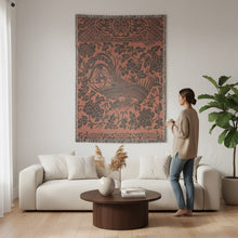Load image into Gallery viewer, Melodia Gallery Phoenix + Floral Cotton Woven Blanket with fringed edges. Features a dark grey phoenix and floral pattern on a rust-orange background.
