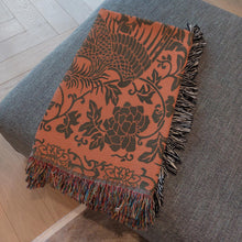 Load image into Gallery viewer, Melodia Gallery orange cotton woven blanket with phoenix and floral pattern, fringed edges.
