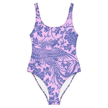 Load image into Gallery viewer, Melodia Gallery baby pink one-piece swimsuit with a purple phoenix and floral print. Features a scoop neckline, low scoop back, and cheeky fit.
