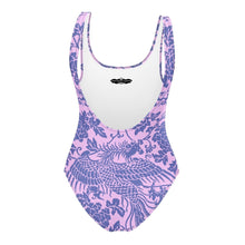 Load image into Gallery viewer, Melodia Gallery baby pink one-piece swimsuit with a purple floral and phoenix print. Features a scoop neckline and low scoop back.
