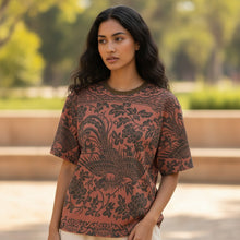 Load image into Gallery viewer, Melodia Gallery oversized burnt orange cotton t-shirt with dark grey phoenix and floral print. Unisex sizing.
