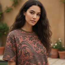 Load image into Gallery viewer, Melodia Gallery oversized cotton t-shirt with a phoenix and floral print in dark brown on a rust background. Unisex sizing.
