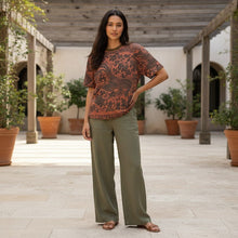 Load image into Gallery viewer, Melodia Gallery oversized cotton t-shirt with a phoenix and floral print in dark brown on a terracotta background. Unisex sizing.
