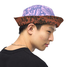 Load image into Gallery viewer, Melodia Gallery reversible bucket hat with intricate phoenix and flora pattern on brown side, lavender and blue on reverse.

