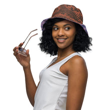 Load image into Gallery viewer, Melodia Gallery reversible bucket hat with phoenix and floral pattern in earth tones on one side, lavender and blue on the other.
