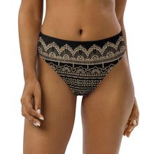 Load image into Gallery viewer, Melodia Gallery black high-waisted bikini bottom with intricate lace-inspired graphic pattern in tan. Recycled material.
