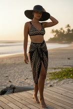 Load image into Gallery viewer, Melodia Gallery black bikini with intricate beige lace pattern, high-waisted bottoms, and removable pads. Recycled polyester.
