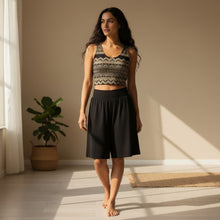 Load image into Gallery viewer, Melodia Gallery Shakti Lace Cotton Crop Top in black with gold lace detail. Form-fitting, sleeveless, and cropped.
