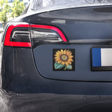 Load image into Gallery viewer, Melodia Gallery vintage-inspired sunflower car magnet with green leaves on a black background.
