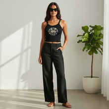 Load image into Gallery viewer, Melodia Gallery black cotton micro-rib tank top with vintage lotus graphic print. Model wears tan linen pants.
