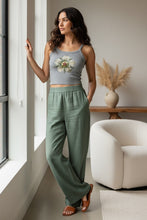 Load image into Gallery viewer, Melodia Gallery grey micro-rib cotton tank top with vintage rosette graphic. Model wears with green linen pants.
